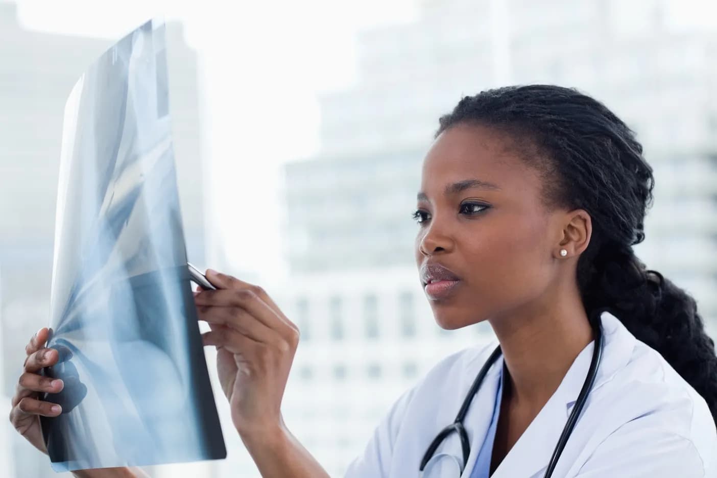 Radiologist examining an X-ray film